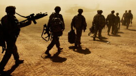 Members of the Army's 10th Mountain Division board a Black Hawk helicopter in Wardak province, Afghanistan. President Obama has deployed thousands of additional troops to Afghanistan, and his top general says even more are needed.