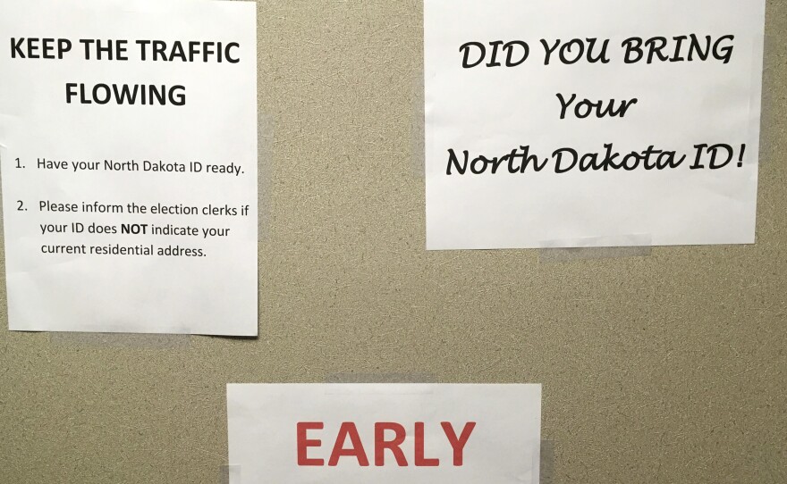 This June, instructions were posted at an early voting precinct in Bismarck, N.D. In that primary election, tribal IDs that did not show residential addresses were accepted as voter ID. But those same IDs will not be accepted in the general election.