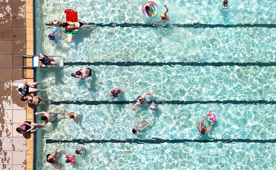 Swimmers keep cool in the hot weather Tuesday in an open-air pool in Letchworth Garden City, Hertfordshire, England.