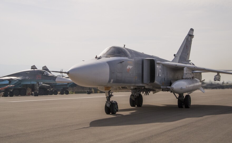 A Russian war plane taxies at Hemeimeem airbase in Syria. Advocates say a no-fly zone would keep Syrian aircraft from attacking anti-government rebels and endangering civilians, which might allow Syrians to feel safe enough to stay put.