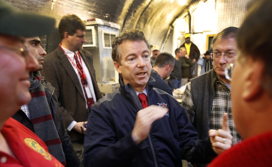 Sen. Rand Paul, R-Ky., center, meets with members of the Londonderry Fish and Game Club, on Jan. 14 in Litchfield, N.H. Paul was one of three GOP presidential hopefuls who attended Sunday's semi-annual gathering of David and Charles Koch's donor network in California.