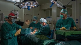 Dr. Galit Sivak (center), head of the vascular surgery department, performs surgery at Rabin Medical Center in Petah Tikvah, Israel. She has developed a surgical procedure during the Gaza war that saved the limbs of 35 severely wounded Israeli soldiers.