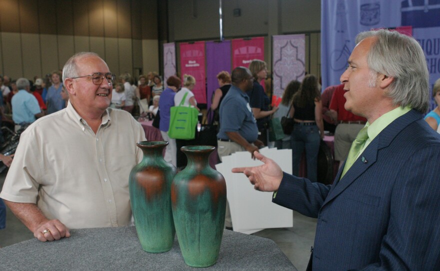 David Rago (right) appraises Charles Clewell vases, ca. 1925, in Oklahoma City, Okla. ANTIQUES ROADSHOW “Never Seen That Before!” airs Monday, May 12 at 8/7C PM on PBS.
