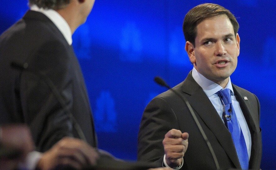 Marco Rubio, right, and Jeb Bush, argue a point during the CNBC Republican presidential debate at the University of Colorado, on Wednesday in Boulder, Colo.