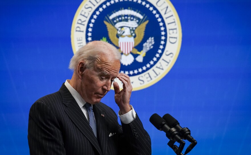 President Biden pauses while speaking after signing an executive order related to manufacturing at the White House Jan. 25. Biden is off to a fast start, but is running into resistance in Congress.