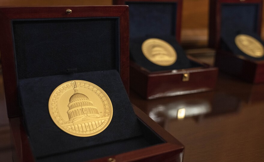 Congressional Gold Medals in honor of the United States Capitol Police, the Washington, D.C., Metropolitan Police and those who protected the U.S. Capitol on Jan. 6, 2021, are seen ahead of a ceremony at the Capitol on Tuesday.