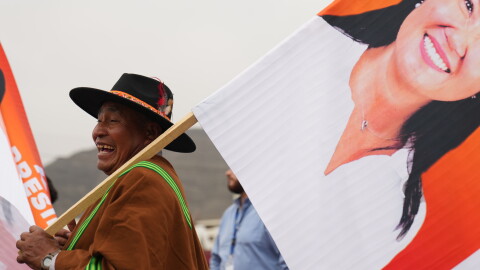 A supporters hols a banner of presidential candidate Keiko Fujimori during her closing campaign rally in Lima, Peru, Thursday.
