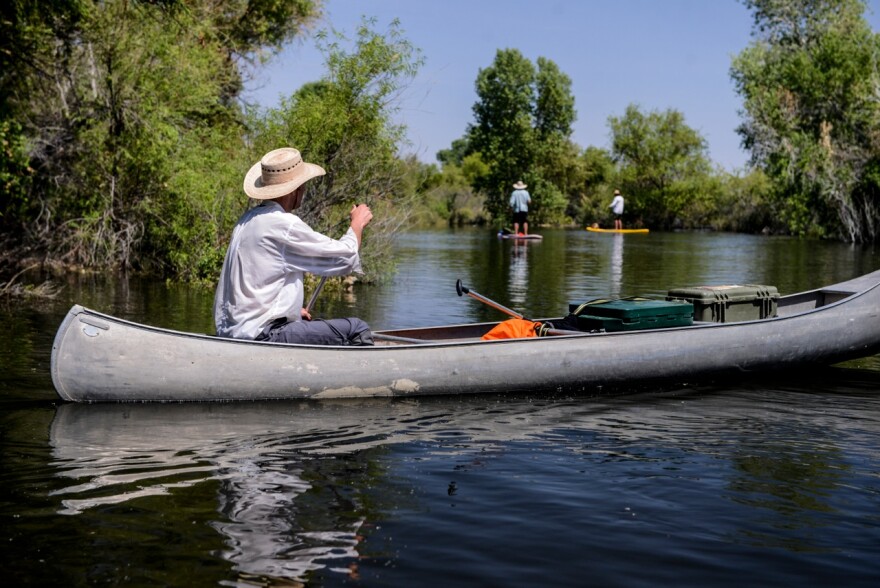 Rowan Jacobsen, in the canoe, and Pete McBride and Sam Walton, on stand-up paddleboards, travel through the upper limitrophe of the Colorado River, along the U.S.-Mexico border. Before the release of water from the Morelos dam, Jacobsen described this parched riverbed as a trench, with big stretches of it bone-dry.