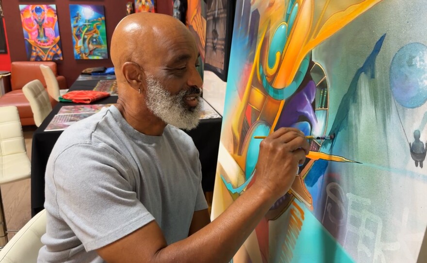 Artist Maxx Moses painting in his studio at Graffiti Gardens in Encanto. Nov. 17, 2025