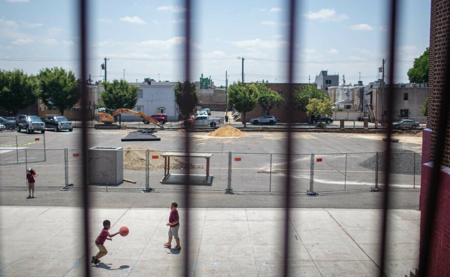 Students play basketball on the last day of the schoolyear at the F. Amedee Bregy School in South Philadelphia. The school broke ground on a renovation of its outdoor space that will include trees, landscaped rain gardens, a track and a basketball court.