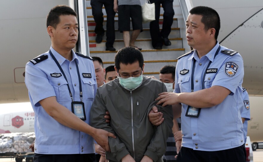 China has launched a major program to arrest suspects who have fled abroad. Six fugitives were brought back from Indonesia to the Capital International Airport in Beijing on Sunday.