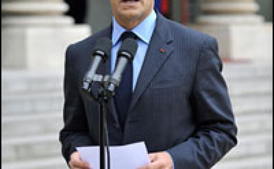 French President Nicolas Sarkozy addresses reporters in Paris, Oct. 6, 2008, before an emergency meeting with the country's leading bankers and insurers amid the ongoing global financial crisis.