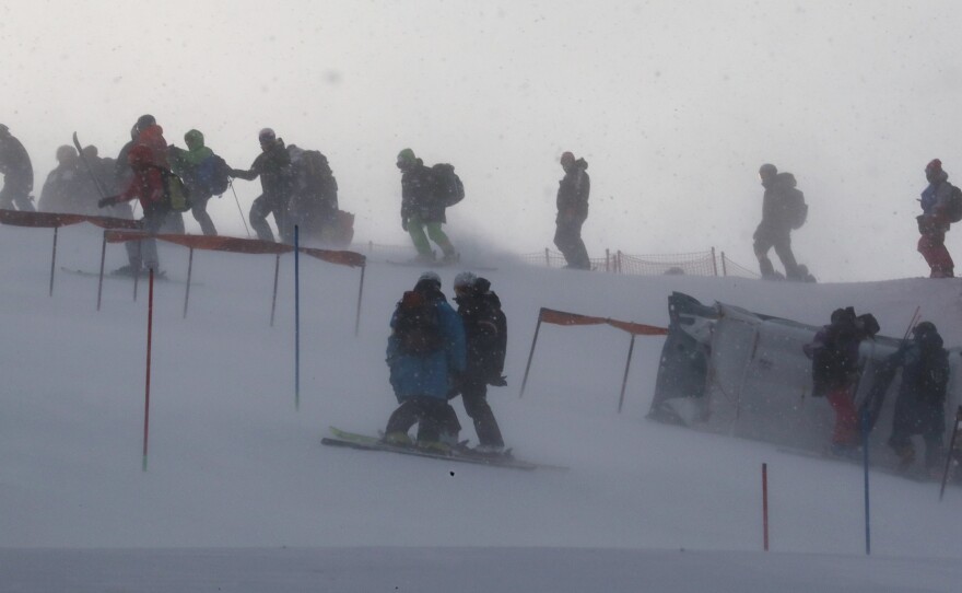 Windy conditions at the Yongpyong Alpine Center forced the delay of the women's slalom race. Here, team members and coaches are seen on the mountain as gusts of wind blew Wednesday morning.