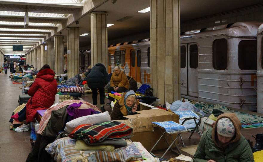 People rest as they take shelter from attacks in a metro station in Kharkiv, Ukraine, on March 10.