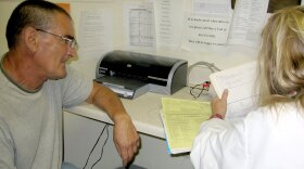 Walter Brooks, a 63-year-old homeless man, is seen by physician assistant Jean Prevas at the Health Care for the Homeless clinic in Baltimore.