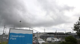 Rain clouds form in the sky over a desalination plant in Sydney, Australia, April 29, 2015. On the world's driest inhabited continent, drought is a part of life, with the struggle to survive in a land short on water a constant thread in the country's history. California is looking to Australia for advice on surviving its own drought.