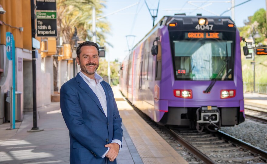 Colin Parent stands near the trolley in this undated image.