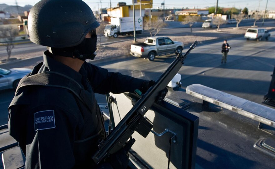 Mexican federal police patrol the streets of Ciudad Juarez during an anti-narcotics operation in March 2009. More than 24,000 Mexicans have died in the country's brutal drug wars since President Felipe Calderon took office in 2006.