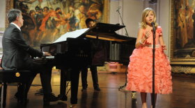 Jackie Evancho performs on stage  with co-host and music director David Foster, at The John and Mable Ringling Museum of Art in Sarasota, Florida.