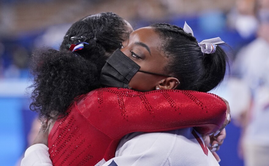 Simone Biles embraces teammate Jordan Chiles after she exited the team final at the Summer Olympics in Tokyo.