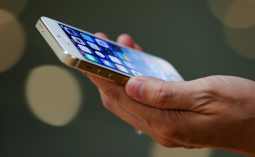 A customer inspects the new iPhone.