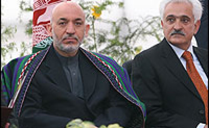 In New Delhi, Hamid Karzai and Afghan Foreign Minister Rangeen Dadfar Spanta attend a road-naming ceremony, honoring a former Afghan leader.