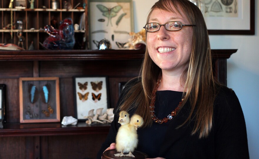 Joanna Ebenstein, creative director of the Morbid Anatomy Museum, poses with a taxidermy two-headed duckling.
