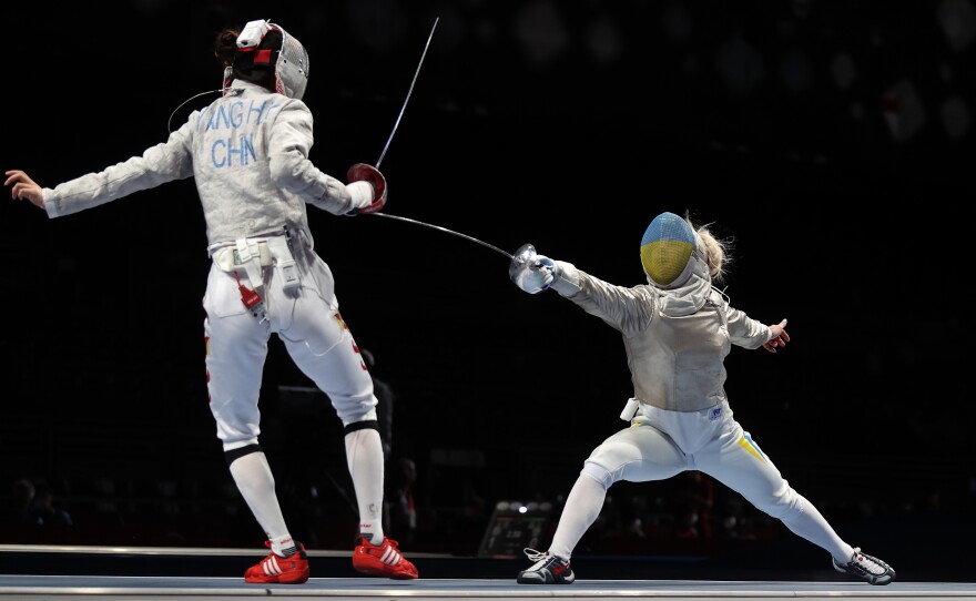 Olga Kharlan of Team Ukraine, right, competes against Hengyu Yang of Team China at the Tokyo Olympic Games at Makuhari Messe on July 26, 2021 in Chiba, Japan.