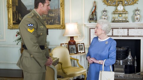 FILE - Britain's Queen Elizabeth II greets Corp. Ben Roberts-Smith from Australia, who was recently awarded the Victoria Cross, during an audience at Buckingham Palace in London, Nov. 15, 2011.