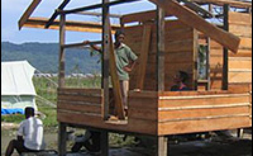 Impatient with the pace of government work, some in Peuken Bada have begun building modest homes on the foundations of homes destroyed by tsunami.
