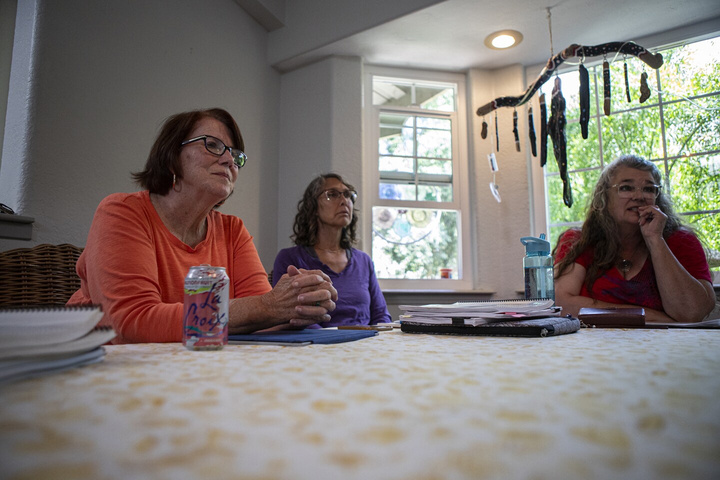 Local residents Joey Racano, Julie Tacker and Nicole Dorman meet in a Los Osos home to discuss their opposition to the Federal plan for an offshore wind farm on July 18, 2023.