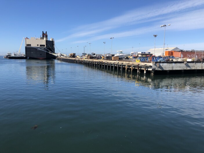 Ship unloading goods at a port facility in National City on Mar. 29, 2021.