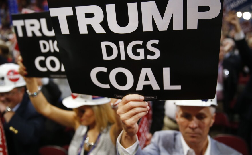 A delegate holds a sign reading "Trump Digs Coal" during the Republican National Convention in Cleveland in 2016.