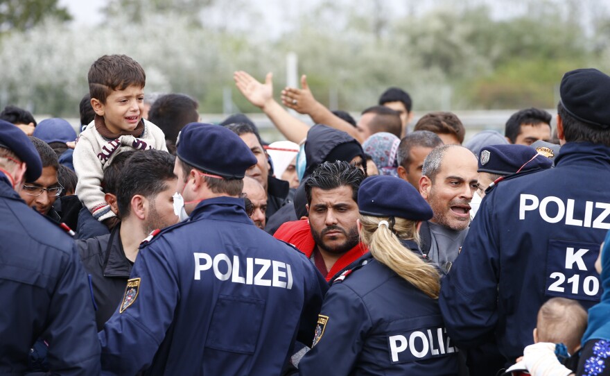 Police attempt to maintain order as migrants try to leave the border crossing in Nickelsdorf, Austria.