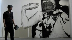 Hugo Crosthwaite at Boffo Projects in New York, in front of one of his wall drawings. The wall drawing shown here is in progress. 