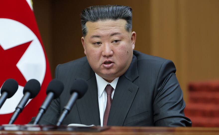 In this photo provided by the North Korean government, its leader Kim Jong Un delivers a speech during a session of the Supreme People's Assembly at parliament in Pyongyang, North Korea Monday, March 23, 2026.