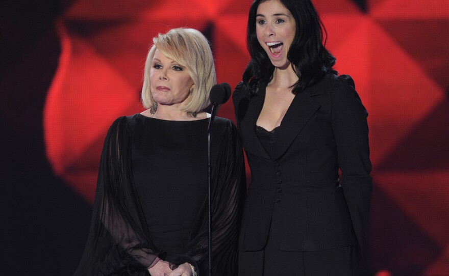 Rivers and Sarah Silverman on stage in 2011 at the annual Critics' Choice Movie Awards. Rivers was an inspiration to younger comics like Silverman and Kathy Griffin.