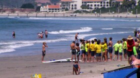 Children getting ready for a surfing lesson on Coronado's Central Beach, July 12, 2022.