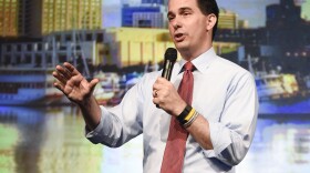 Republican presidential candidate, Wisconsin Gov. Scott Walker, waves after speaking at the American Legislative Exchange Council's annual meeting in San Diego, July 23, 2015.