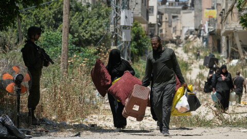 Palestinians collect their belongings from their evacuated homes after the Israeli army issued a number of short term access permits for residents of the occupied West Bank refugee camp of Tulkarem, Wednesday, June 17, 2026.