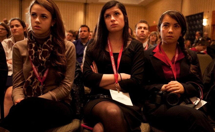 High school students Hannah Carroll, 18, Meghan Corbett, 17, and Leah Campbell, 17, all from Newburyport High School in Massachusetts react to Santorum. Their classmate, Rhiannon Pyle, 17, provoked a heated debate when she asked Santorum a question about his stance on gay marriage.