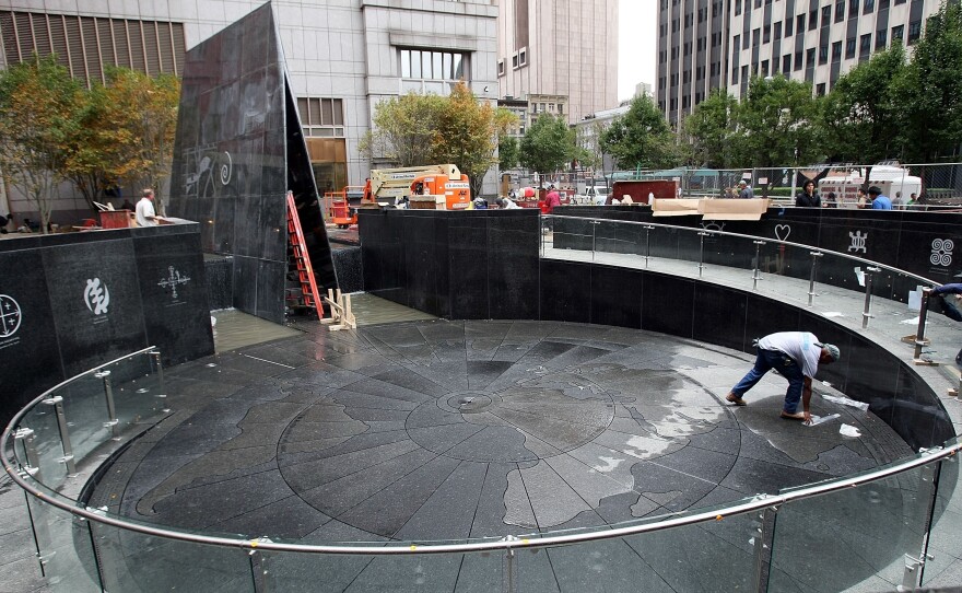 A worker helps complete construction of the African Burial Ground Memorial on Oct. 1, 2007, in New York City.