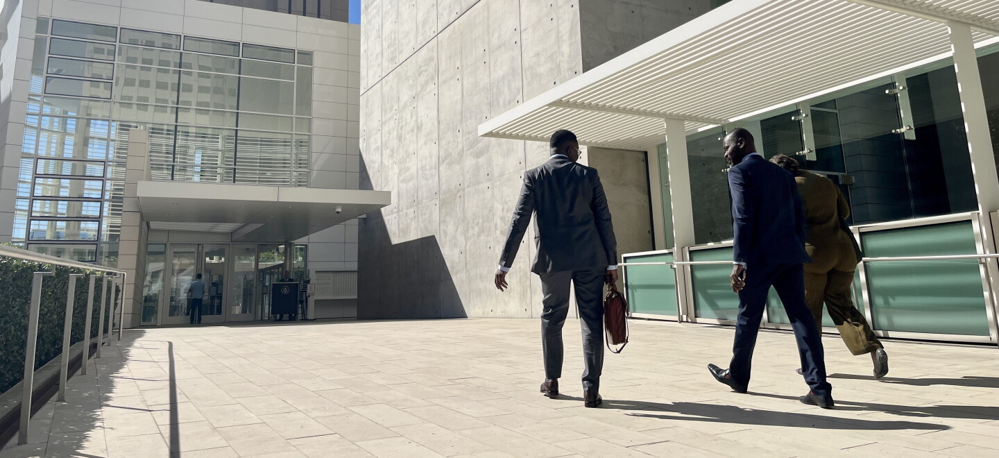 Attorney Wismick Saint-Jean walks into the United States Courthouse in downtown San Diego alongside his paralegal and Haitian Bridge Alliance co-founder Wister Gaetan, Oct, 16. 2026.