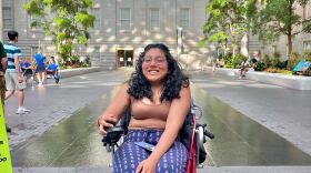 Shruti Rajkumar sitting in a wheelchair at a museum in Washington, D.C.