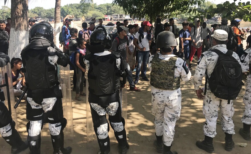 Mexico's National Guard prevents migrants who walked across the river from making their way further into Mexico.