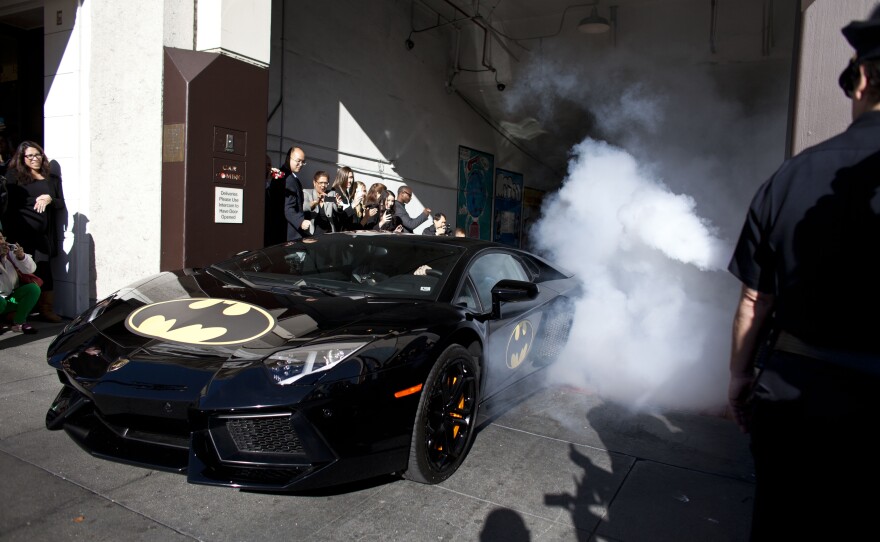 To the Batmobile! Batkid exits his cave at Union Square.