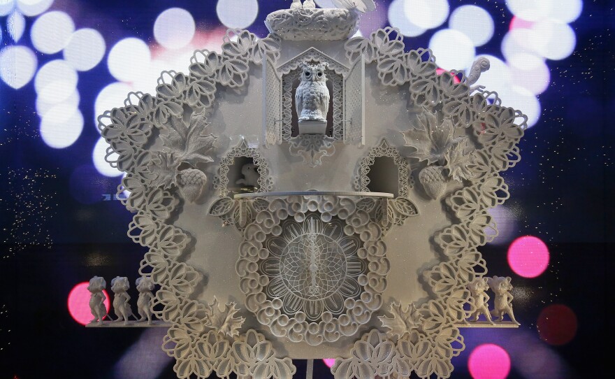 The cuckoo clock is showcased in one of five Lord and Taylor window displays. At midnight, a fireworks animation explodes in the background.