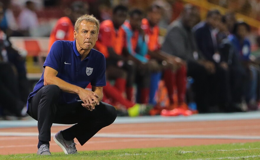 U.S. coach Jürgen Klinsmann studies the play during a World Cup qualifier between his squad and Trinidad and Tobago in November in Port of Spain, Trinidad and Tobago.