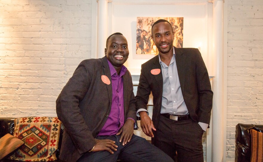 Manyang Reath Kher (left) came to the U.S. as a teenage refugee, one of the so-called Lost Boys of Sudan. Today he runs a nonprofit called Humans Helping Sudan. He's pictured with the organization's operations manager, Elvis Hedji.