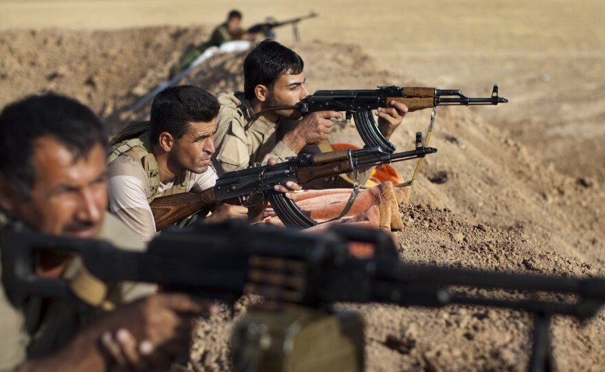 Iraqi Kurdish Peshmerga fighters hold a position on the front line in the Gwer district, 25 miles south of Erbil, the capital of the Kurdish region, on Sept. 15. Aided by U.S. airstrikes, the Kurds have been able to retake some positions from the Islamic State.